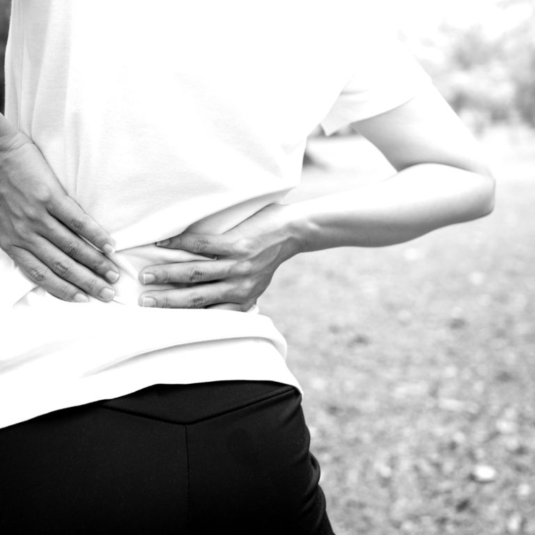 backache woman in park,  back pain and injury as work out or exercise